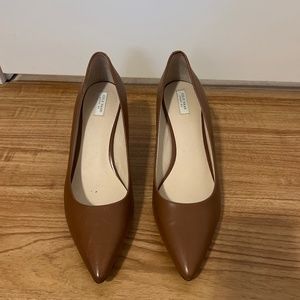 Brown leather pumps